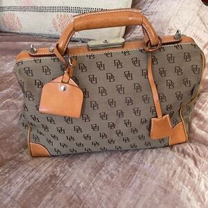 Dooney and Bourke vintage satchel bag. Great condition. Missing long strap.